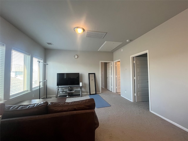 10427 Cecilia Star Ln, Richmond, TX 77406 - carpeted living area featuring visible vents and baseboards