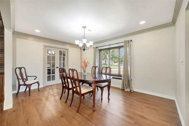 18614 Prince William Ln, Houston, TX 77058 - dining room featuring a notable chandelier, baseboards, and ornamental molding