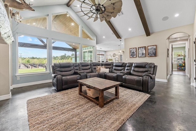 living room featuring beamed ceiling, arched walkways, baseboards, and high vaulted ceiling