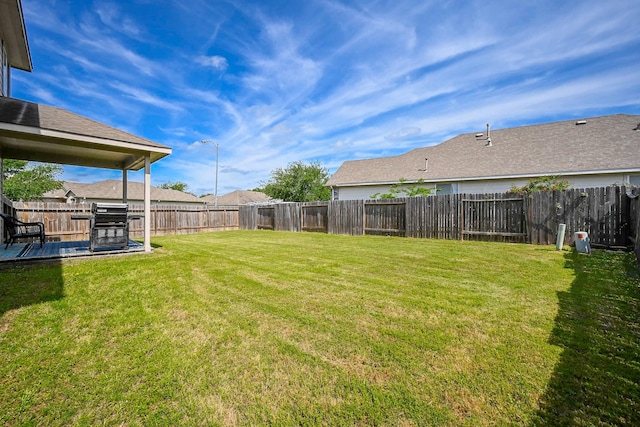 view of yard featuring a fenced backyard