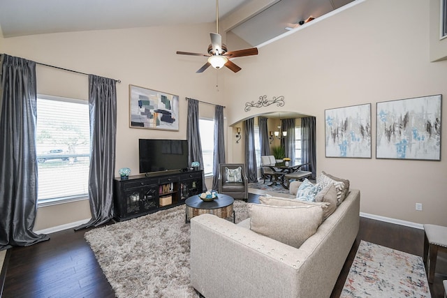 living room with a ceiling fan, arched walkways, dark wood-style flooring, and baseboards