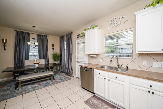 kitchen featuring an inviting chandelier, dishwasher, a wealth of natural light, and a sink