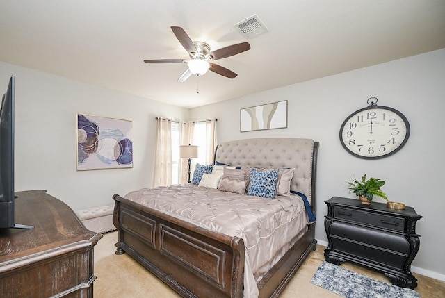 bedroom featuring light carpet, baseboards, visible vents, and ceiling fan