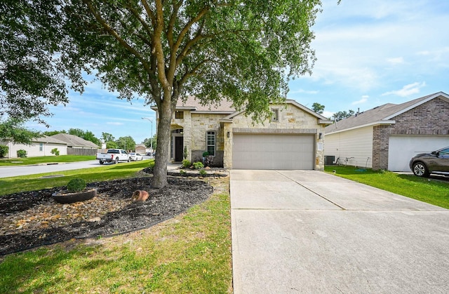 view of front of home featuring an attached garage, driveway, stone siding, and a front lawn