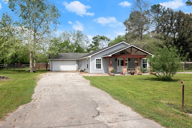 8703 County Road 48, Rosharon, TX 77583 - view of front of house with driveway, covered porch, and an attached garage