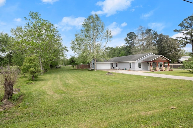 8703 County Road 48, Rosharon, TX 77583 - view of yard featuring driveway and an attached garage