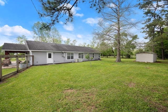 8703 County Road 48, Rosharon, TX 77583 - back of property featuring central AC