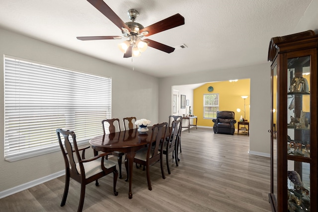 8703 County Road 48, Rosharon, TX 77583 - dining room featuring a ceiling fan, wood finished floors, and baseboards