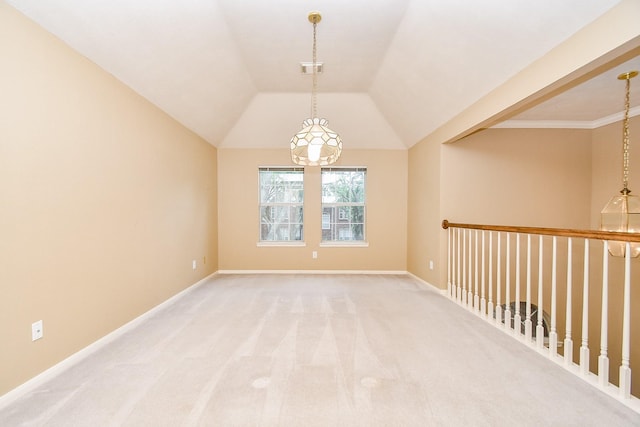 empty room with vaulted ceiling, baseboards, and light colored carpet