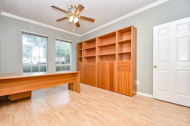 interior space featuring light wood-type flooring, ceiling fan, baseboards, and ornamental molding
