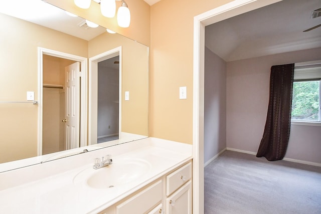 bathroom with baseboards and vanity