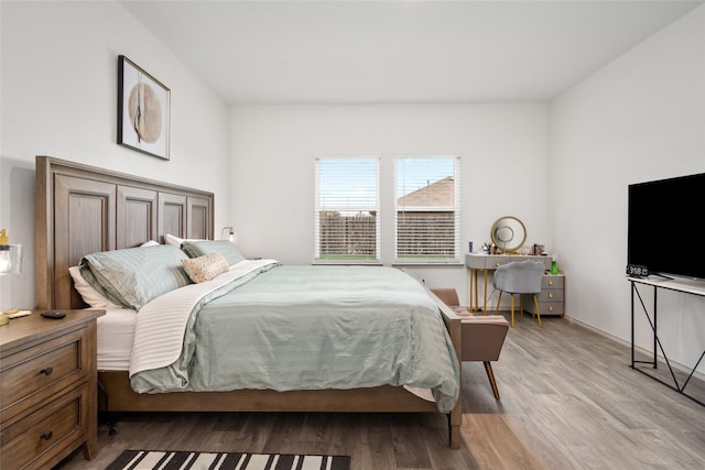 bedroom with light wood-type flooring