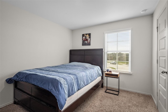 carpeted bedroom with baseboards