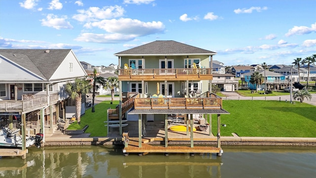 23006 Martes St, Galveston, TX 77554 - back of house with a deck with water view, a residential view, a yard, and boat lift