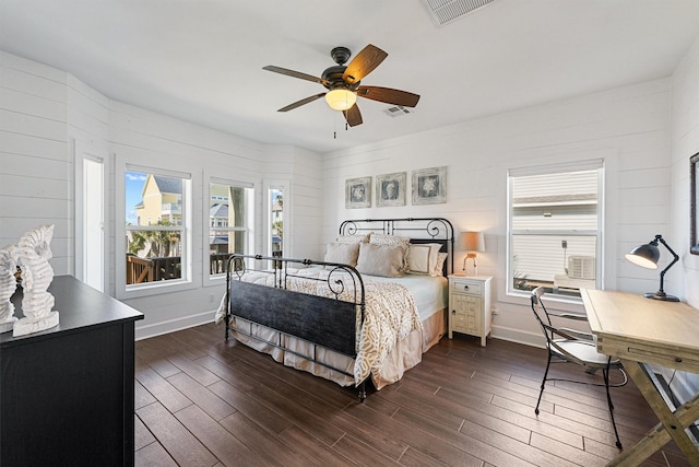 23006 Martes St, Galveston, TX 77554 - bedroom featuring dark wood finished floors, baseboards, and ceiling fan
