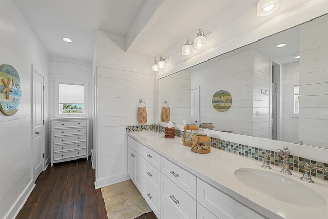 23006 Martes St, Galveston, TX 77554 - full bathroom with wood finished floors, double vanity, and recessed lighting