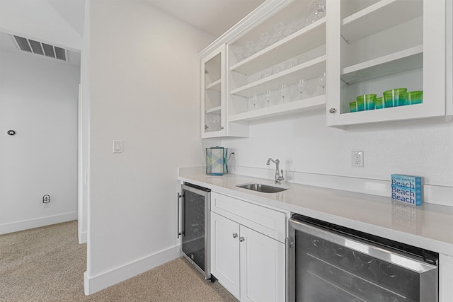 23006 Martes St, Galveston, TX 77554 - kitchen featuring wine cooler, light countertops, and a sink