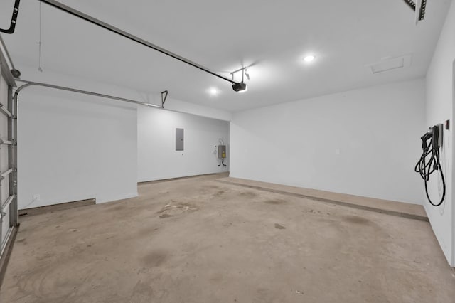 garage featuring a garage door opener and electric panel