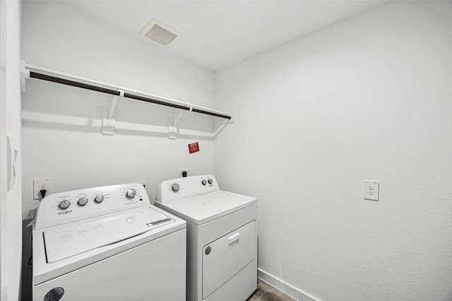 12305 Brandenburg Gate Dr, Houston, TX 77047 - clothes washing area with laundry area, washing machine and clothes dryer, baseboards, and visible vents