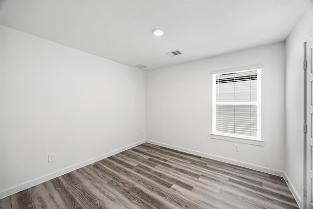 12305 Brandenburg Gate Dr, Houston, TX 77047 - unfurnished room with visible vents, baseboards, and wood finished floors