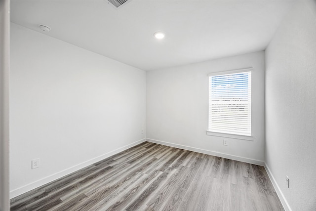 12305 Brandenburg Gate Dr, Houston, TX 77047 - spare room with visible vents, baseboards, and wood finished floors