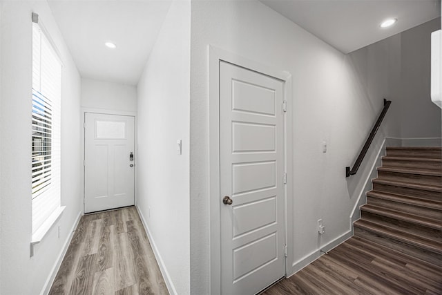 12305 Brandenburg Gate Dr, Houston, TX 77047 - interior space featuring baseboards, stairway, and wood finished floors