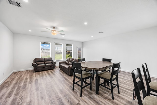 12305 Brandenburg Gate Dr, Houston, TX 77047 - dining space with visible vents, baseboards, a ceiling fan, and wood finished floors