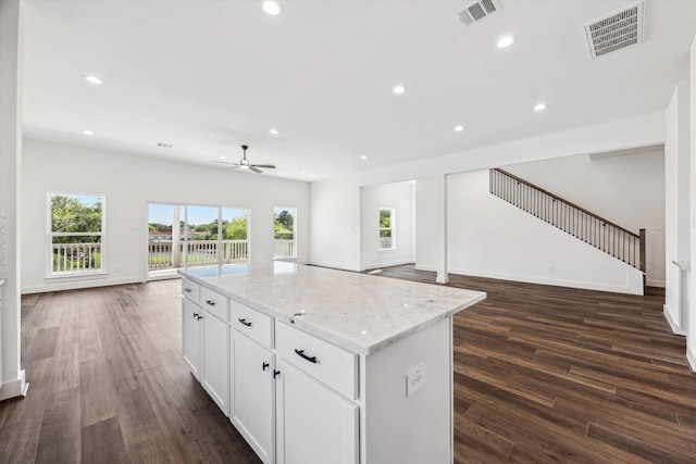 kitchen featuring open floor plan, dark wood-type flooring, ceiling fan, and visible vents