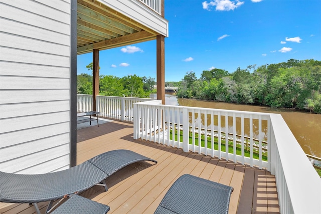 wooden deck with a water view