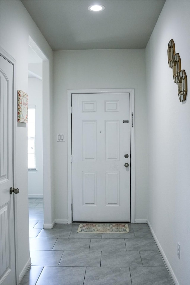 interior space with recessed lighting and baseboards
