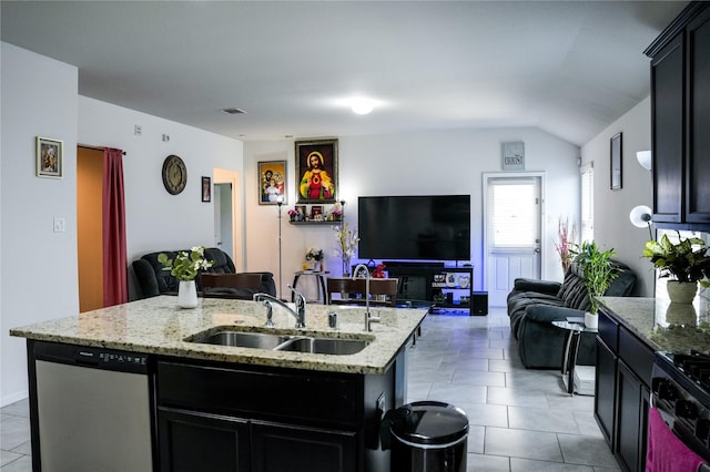 kitchen with open floor plan, gas range, dishwasher, and a sink