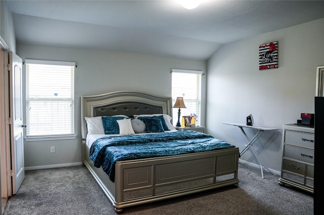 bedroom with baseboards, carpet, and vaulted ceiling