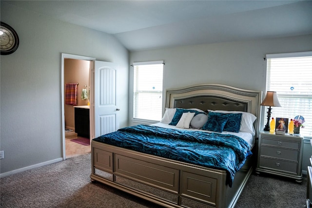 bedroom with dark carpet, baseboards, multiple windows, and vaulted ceiling