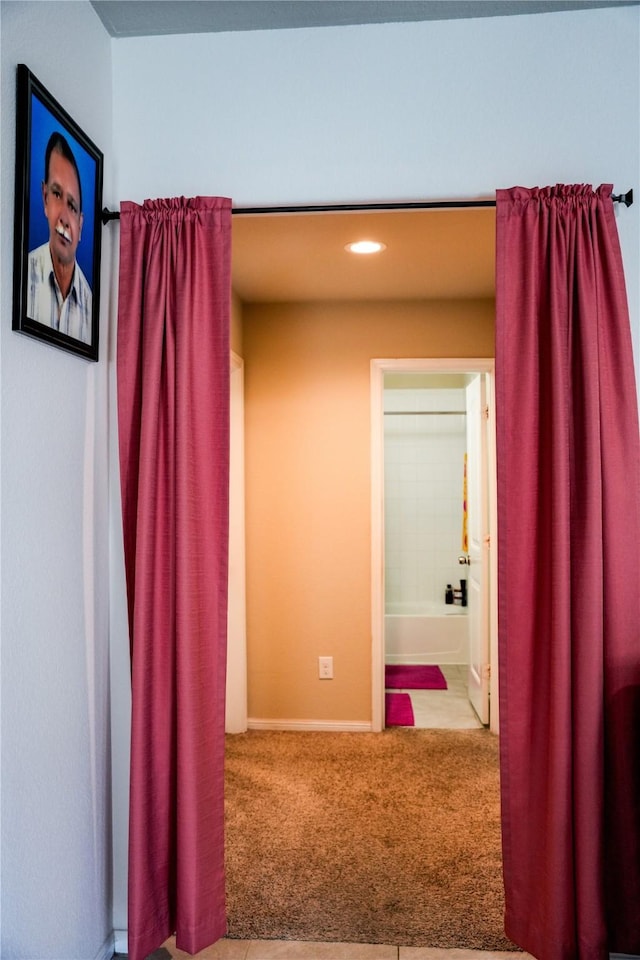 hall featuring recessed lighting, baseboards, and carpet floors