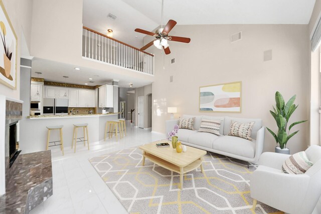 4902 Bellmead Dr, Missouri City, TX 77459 - living room featuring ceiling fan, a towering ceiling, and a tile fireplace