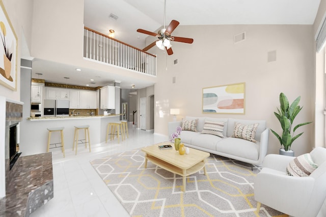 4902 Bellmead Dr, Missouri City, TX 77459 - living room featuring a ceiling fan, a high ceiling, and a fireplace