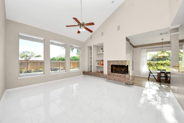 4902 Bellmead Dr, Missouri City, TX 77459 - unfurnished living room featuring built in features, baseboards, ceiling fan, marble finish flooring, and high vaulted ceiling