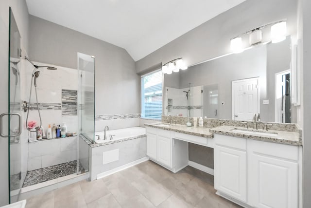 4902 Bellmead Dr, Missouri City, TX 77459 - bathroom featuring a stall shower, a garden tub, double vanity, and lofted ceiling