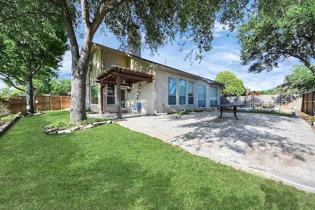 4902 Bellmead Dr, Missouri City, TX 77459 - back of property featuring a pergola, a patio, and brick siding