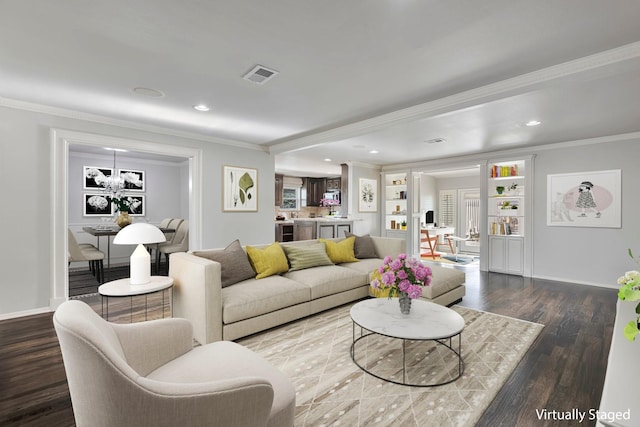 living room featuring visible vents, ornamental molding, wood finished floors, and recessed lighting