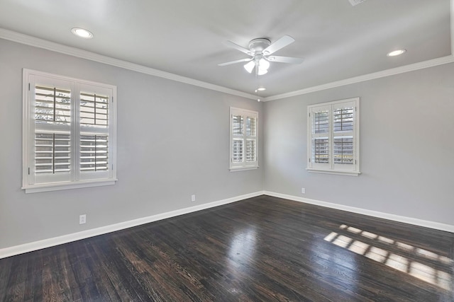 spare room with baseboards, a ceiling fan, and a wealth of natural light