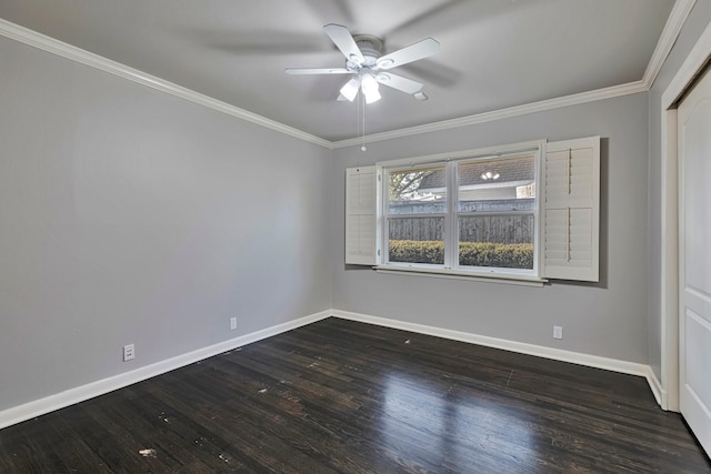 spare room with baseboards, crown molding, ceiling fan, and dark wood-style floors