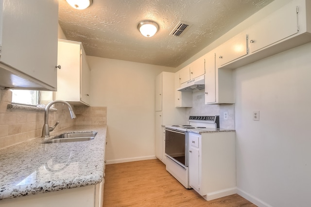 kitchen with light wood-type flooring, under cabinet range hood, visible vents, white electric range, and a sink