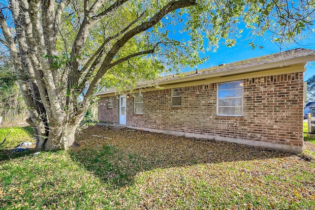 view of home's exterior featuring brick siding