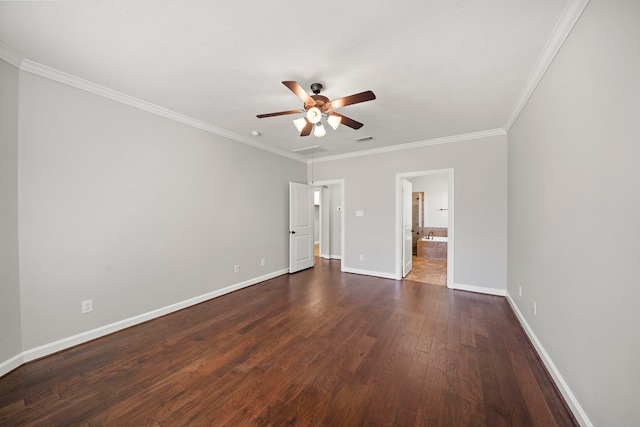 unfurnished bedroom featuring visible vents, baseboards, ornamental molding, connected bathroom, and dark wood-type flooring