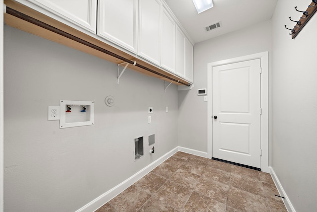 laundry area with visible vents, hookup for an electric dryer, gas dryer hookup, baseboards, and cabinet space