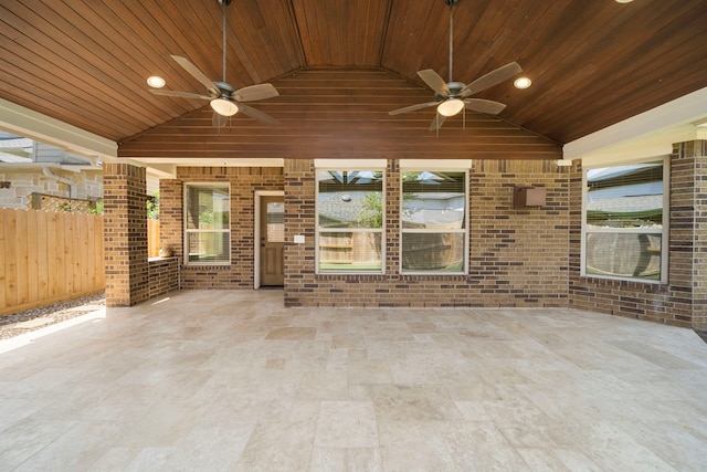 view of patio featuring ceiling fan and fence