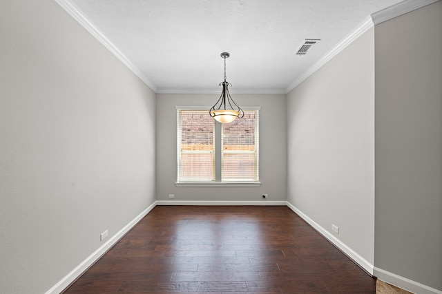 empty room with crown molding, baseboards, dark wood-style floors, and visible vents