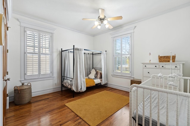 6114 Truro St, Houston, TX 77007 - bedroom with ornamental molding, baseboards, and wood finished floors
