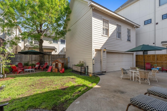 6114 Truro St, Houston, TX 77007 - rear view of property with a patio, a garage, and fence